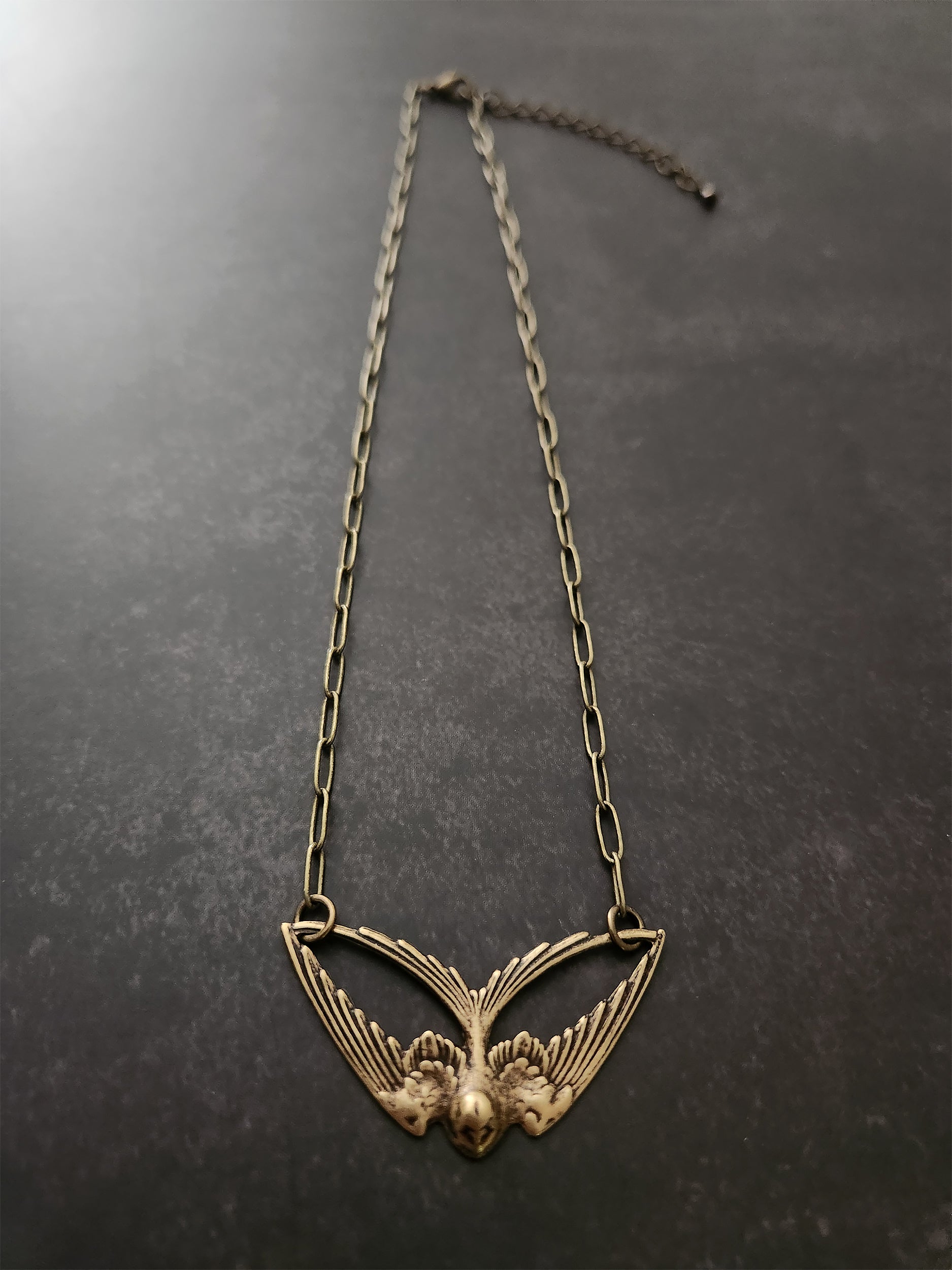 geo swallow necklace