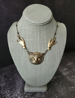 giving hands owl necklace