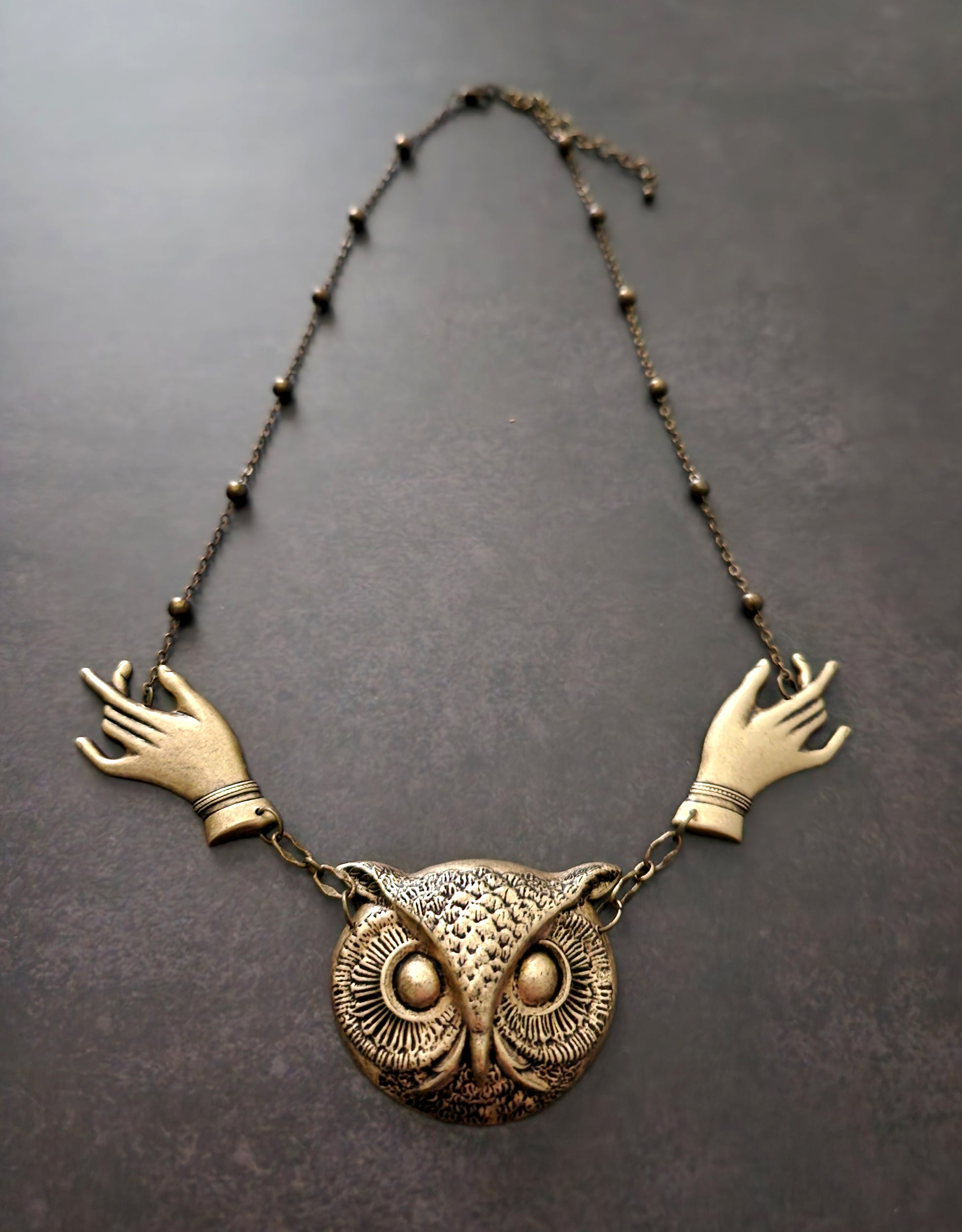 giving hands owl necklace